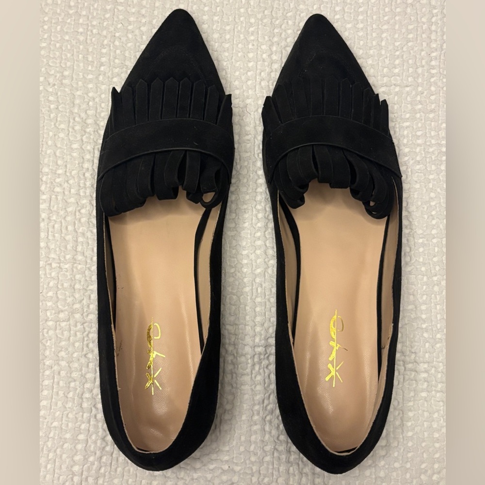 Black leather dress flats.